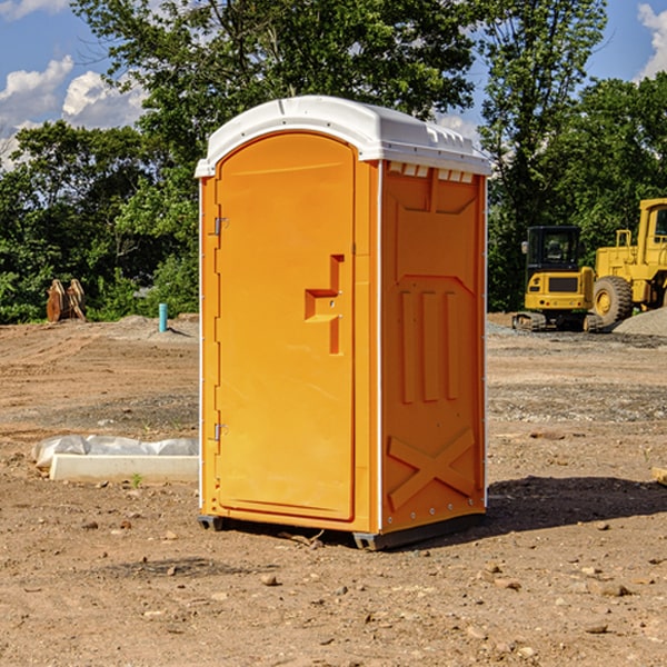 what is the cost difference between standard and deluxe portable restroom rentals in Coupland